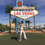 Elvis Impersonator JD King in front of Las Vegas sign