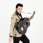 Elvis impersonator JD King as 1950s Elvis with guitar
