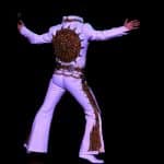 Elvis impersonator JD King on stage in Sundial jumpsuit
