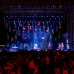Elvis impersonator JD King on stage with live band in Dubai