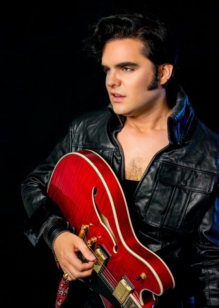 Elvis impersonator JD King 68 comeback special black leather with red guitar