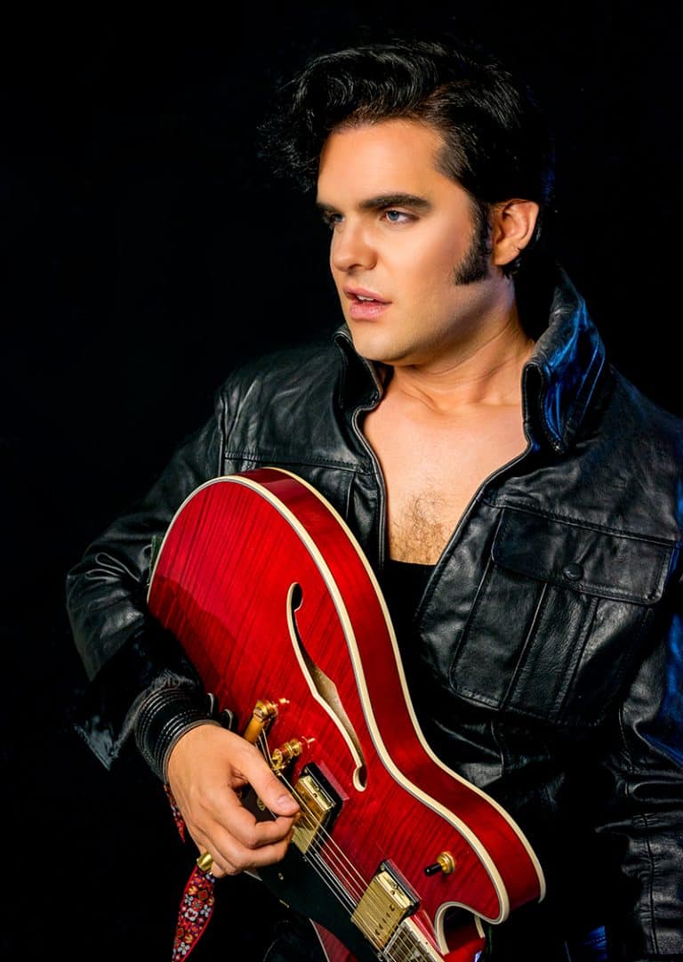 Elvis impersonator JD King 68 comeback special black leather with red guitar